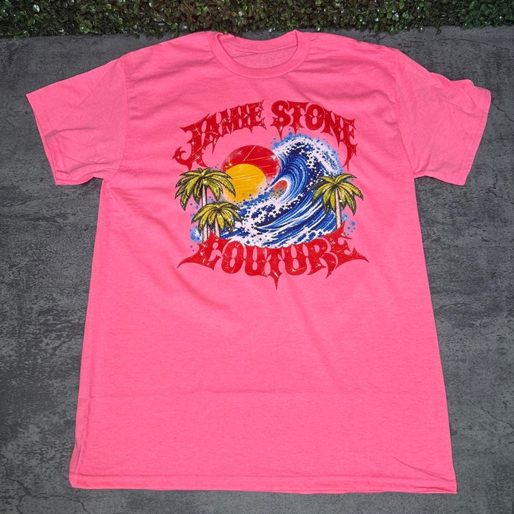 Pink Jamie Stone Couture tee with a blue wave, sunset and palm trees