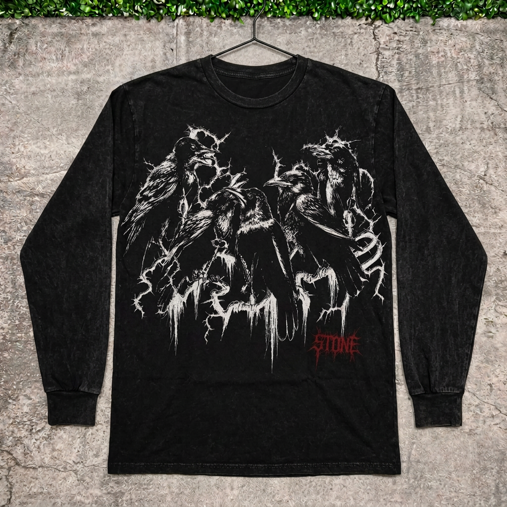 Raven thorn long-sleeve tee on a hanger against concrete with grass above