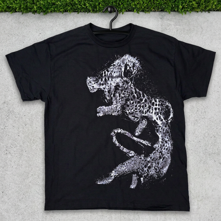 Black silver leaping cheetah tee on a hanger against concrete