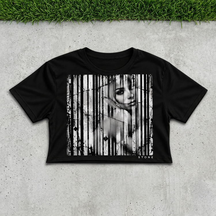 Black barcode portrait crop flat lay on concrete with grass above