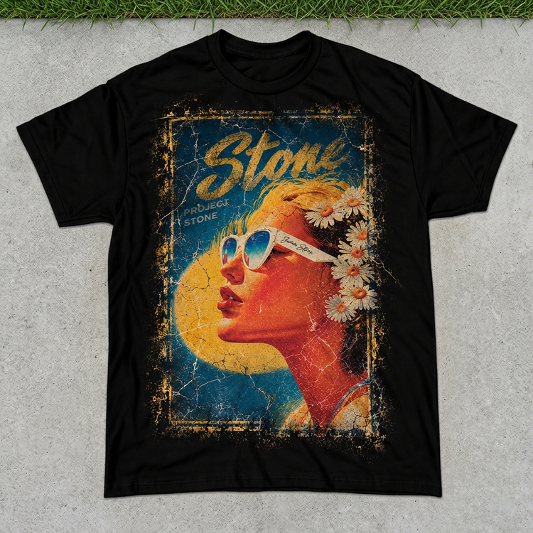 Black STONE sunglasses portrait tee flat lay on concrete with green grass above