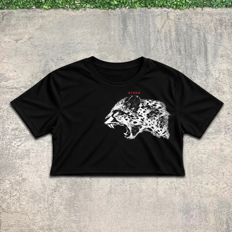 Roaring leopard crop flat lay on concrete with grass above