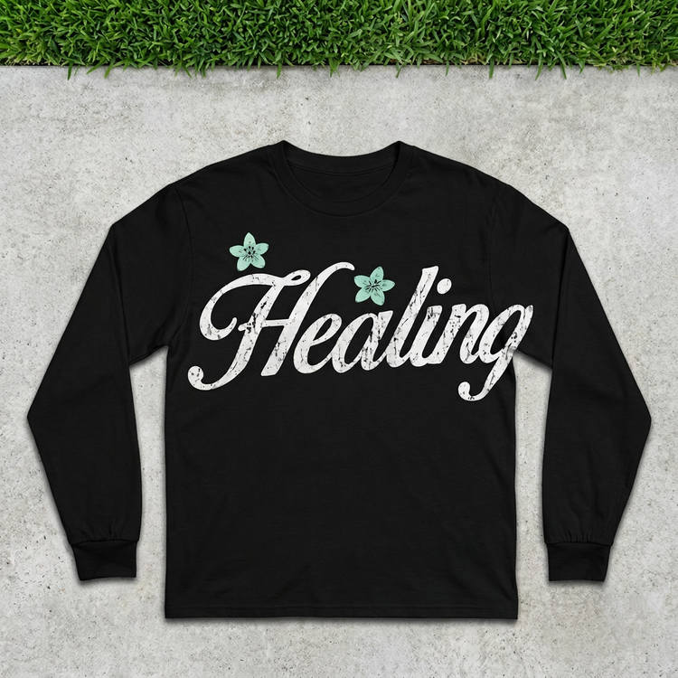 Healing Script Long Sleeve flat lay on concrete