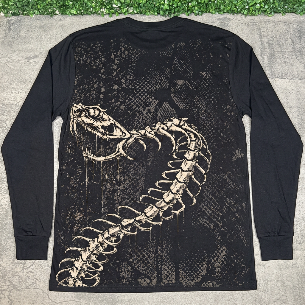 Back of black STONE skeletal serpents long sleeve with bone snake, flat lay on concrete