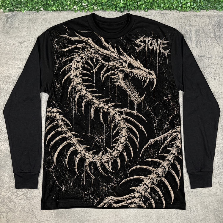 Front of black STONE skeleton dragon long sleeve, flat lay on concrete