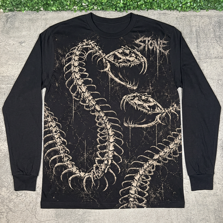 Front of black STONE skeletal serpents long sleeve, flat lay on concrete