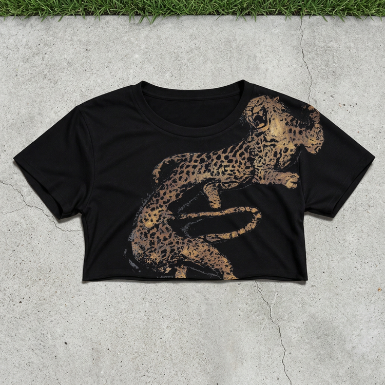 Leaping cheetah crop flat lay on concrete with grass above