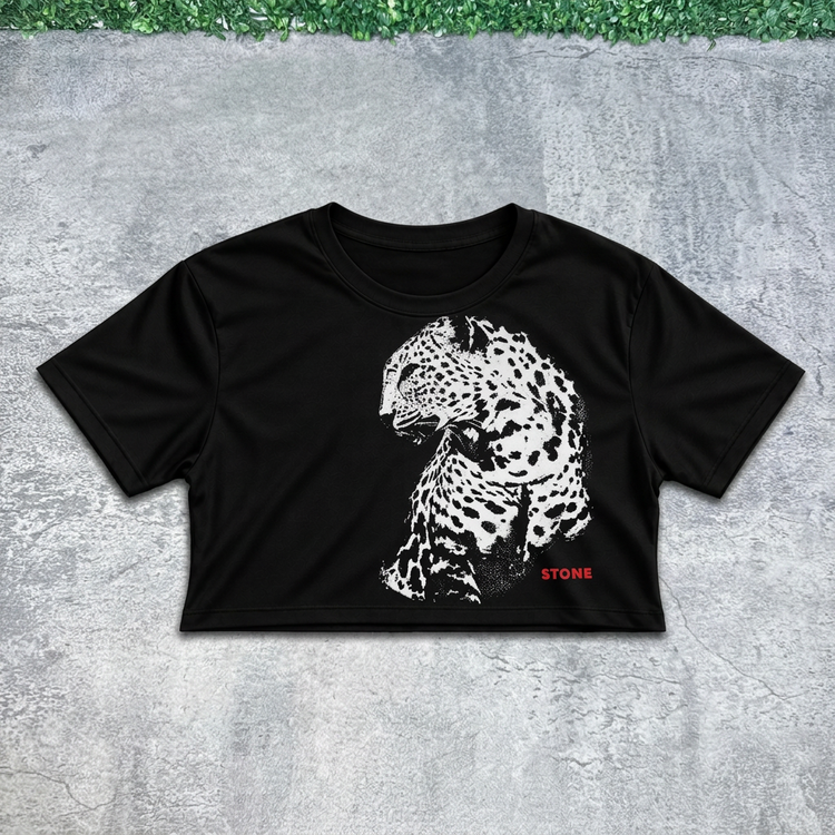 Leopard portrait crop flat lay on concrete with grass above