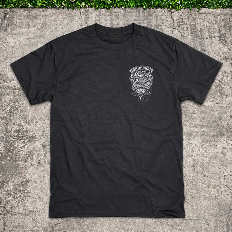 Crest Pocket Tee main photo with AI-edited concrete and greenery backdrop