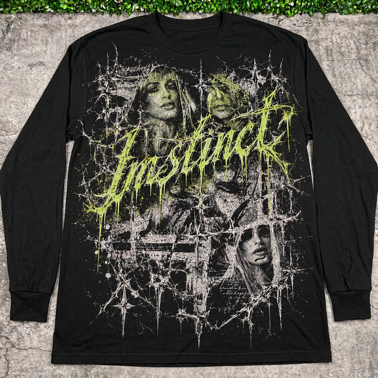 Black Instinct Thorn long sleeve flat lay on concrete with grass above