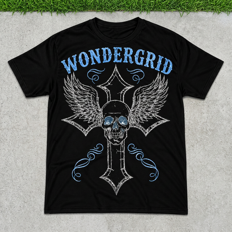 Black blue skullwing cross tee flat lay on concrete with grass above