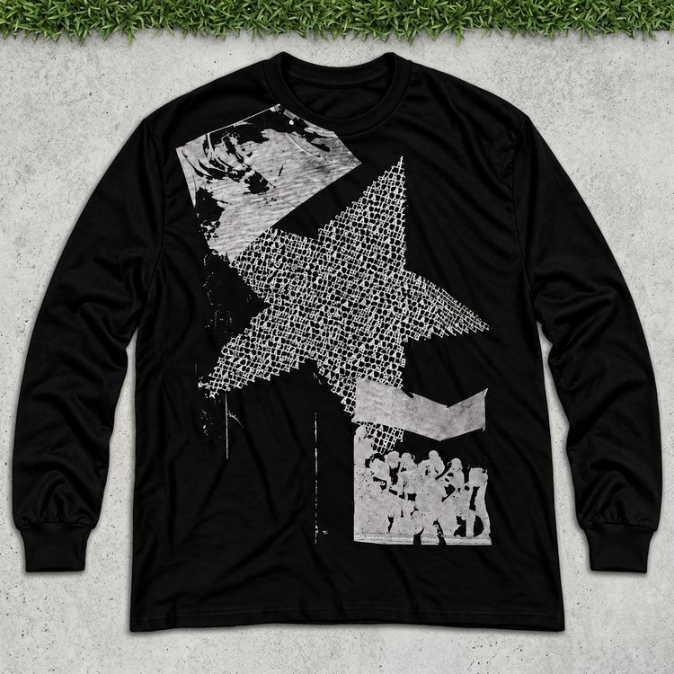 Black star collage long sleeve flat lay on concrete with thin green grass strip